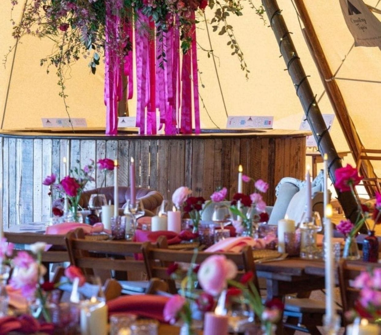 Artfully styled outdoor catering table with sophisticated décor prepared for wedding guests